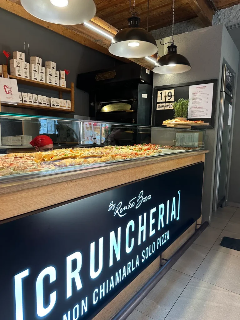 Cruncheria Verona sheet pizza display with DoppioCrunch slices – what to eat in Verona street food spot
