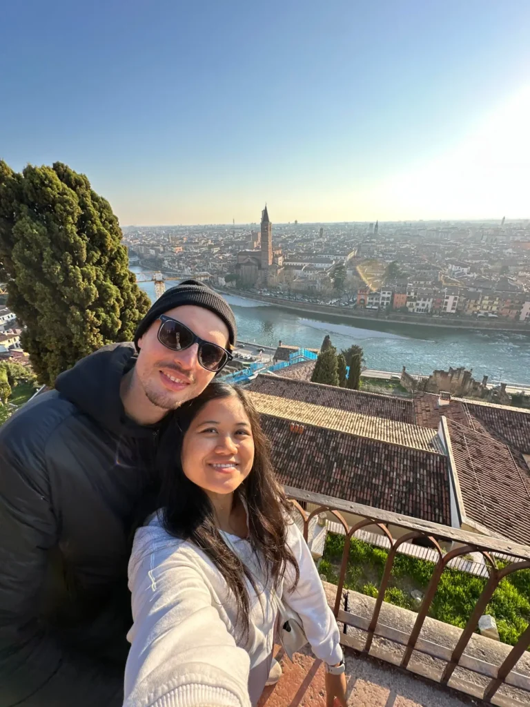View over Veronetta Verona from Castel San Pietro with couple overlooking the Adige River