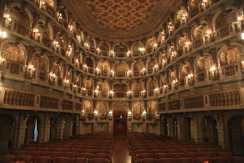 Opulent interior of Teatro Bibiena in Mantua, Italy—an 18th-century jewel of Baroque architecture.