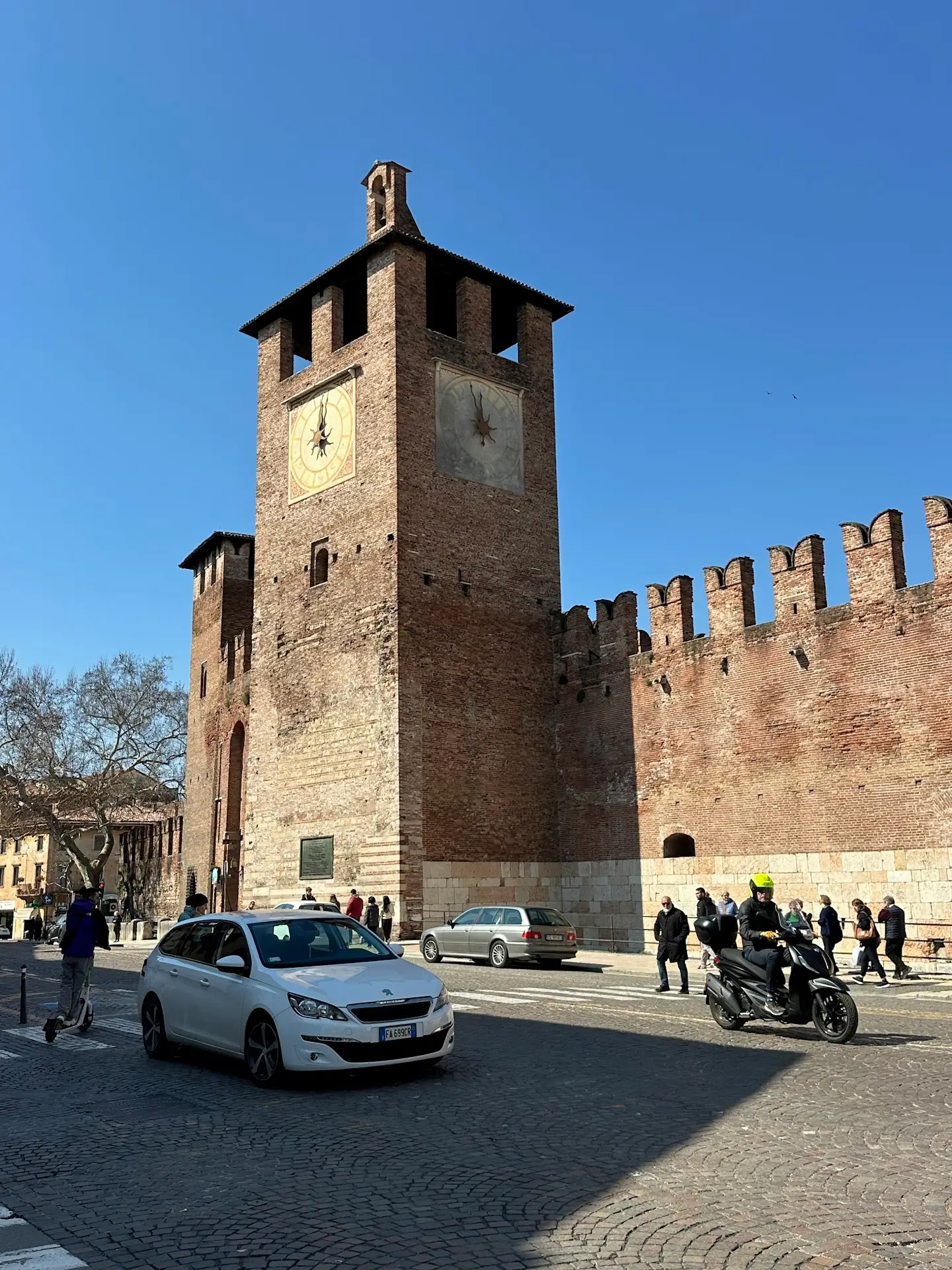 Castelvecchio clock tower and medieval walls in Verona, a historic landmark you can enjoy as one of the free things to do in Verona on foot.