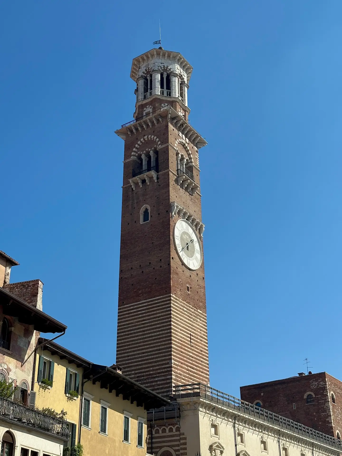 Torre dei Lamberti tower rising above Piazza delle Erbe in Verona, the tallest medieval tower in the city.