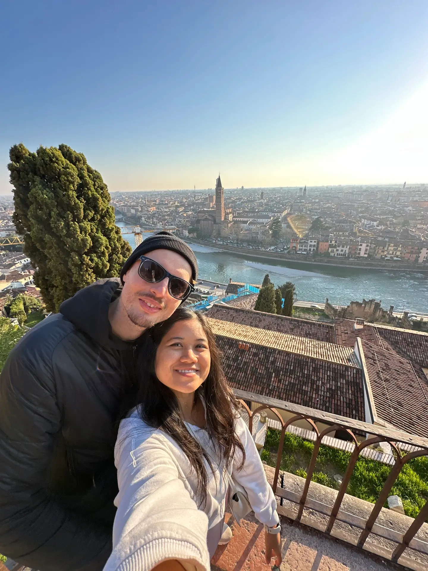 Castel San Pietro Verona viewpoint selfie overlooking Adige River, rooftops, and church towers